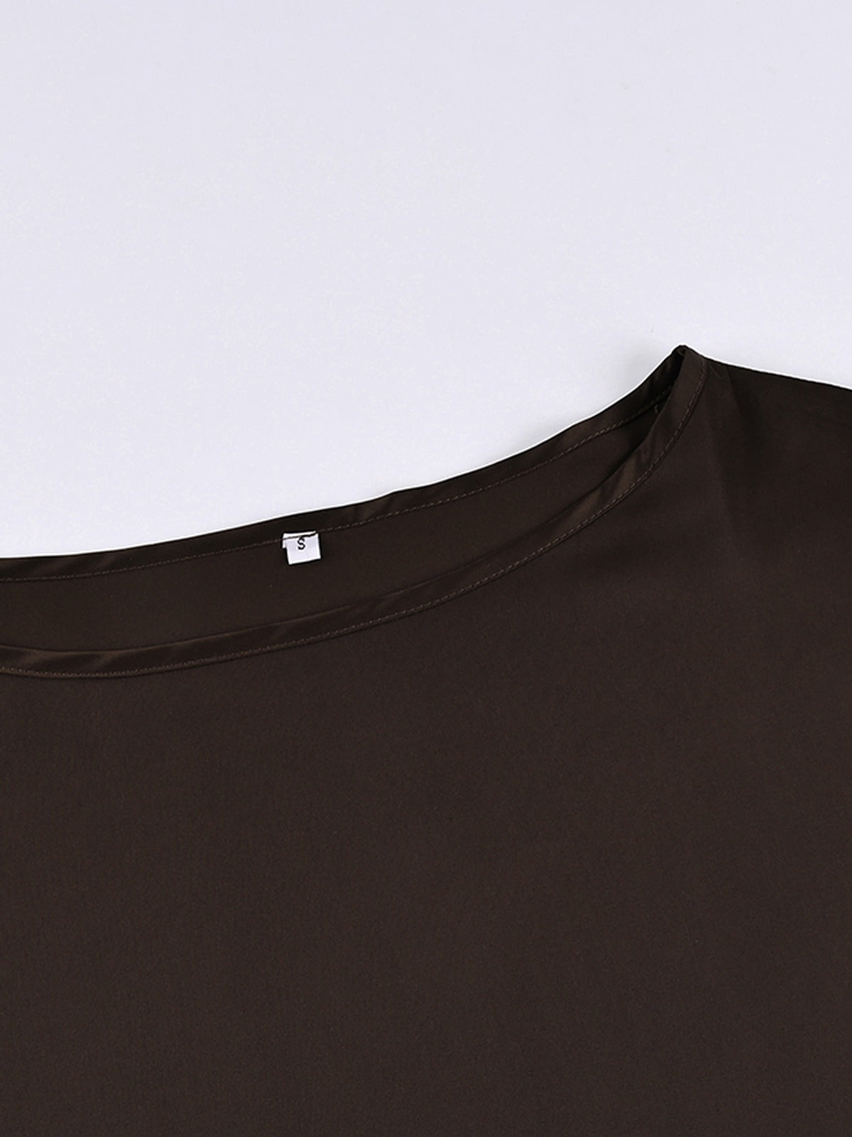 Close up of the bound boat neckline on the chocolate satin blouse