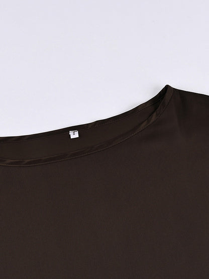 Close up of the bound boat neckline on the chocolate satin blouse