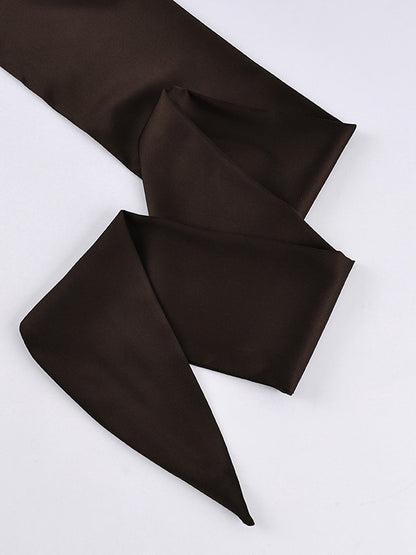 The separate satin tie sash that comes with the blouse