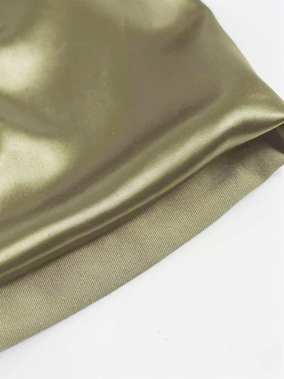 Close up of the satin weave, lustrous face and matte reverse at the hem