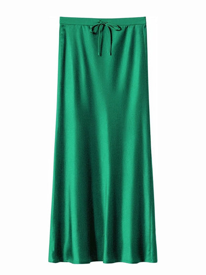 Emerald green satin maxi skirt with a drawstring tie waist, front view