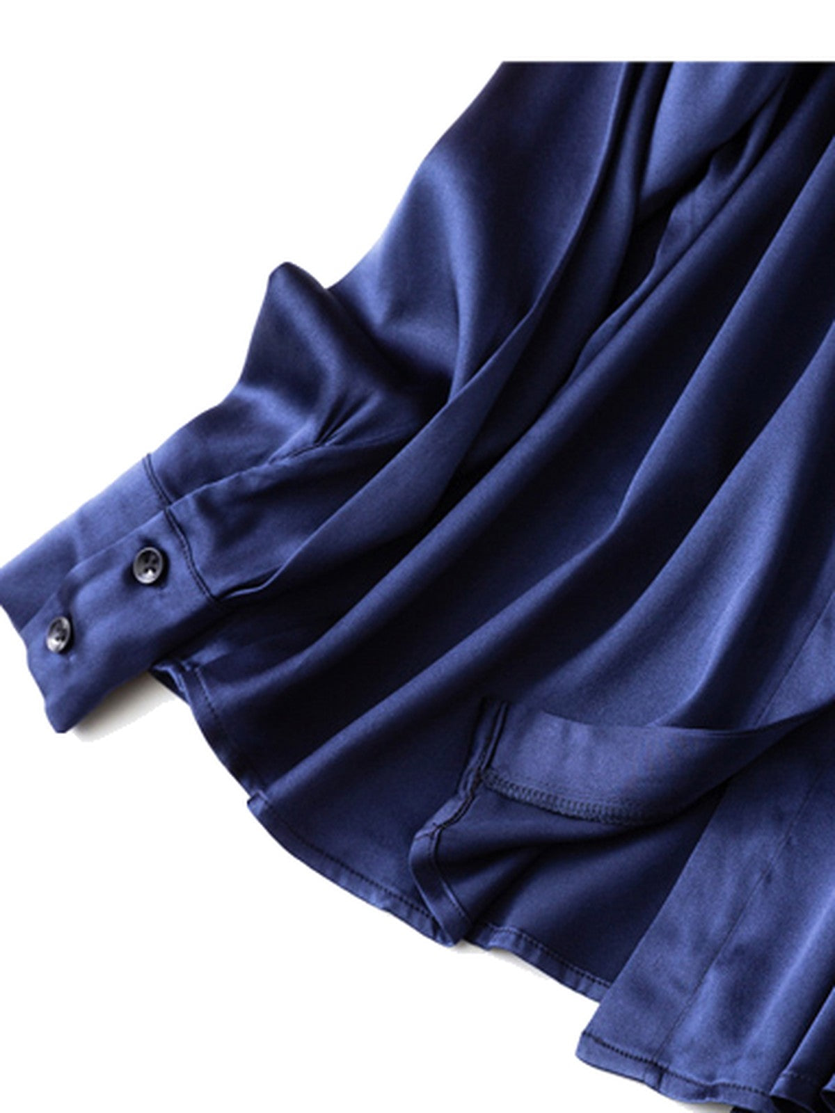 Curved shirttail hem and two button barrel cuff of the navy satin shirt