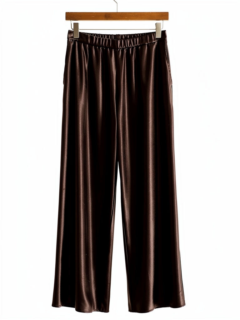 Chocolate satin trousers on a hanger, showing the elasticated pull on waistband and the wide straight leg