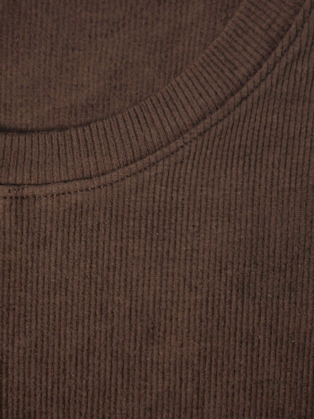 Close up of the fine vertical rib and the narrow crew neck binding of the silk blend top