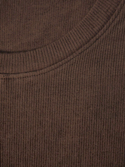 Close up of the fine vertical rib and the narrow crew neck binding of the silk blend top