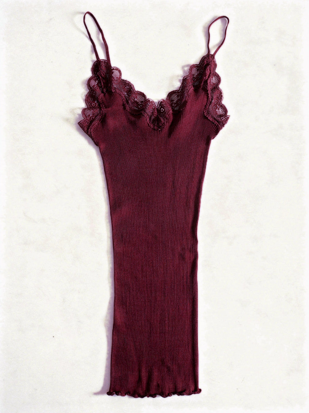 Claret silk cami in a fine ribbed knit with lace trim, shown flat on white