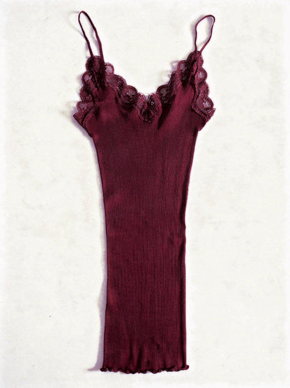 Claret silk cami in a fine ribbed knit with lace trim, shown flat on white