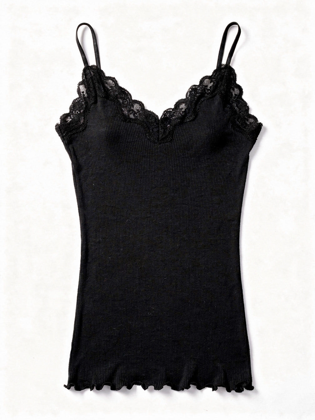 Jet black silk cami in a fine ribbed knit with lace trim, shown flat on white