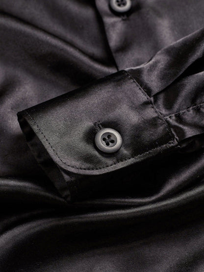 Close up of the black silk cloth and the barrel cuff of the shirt