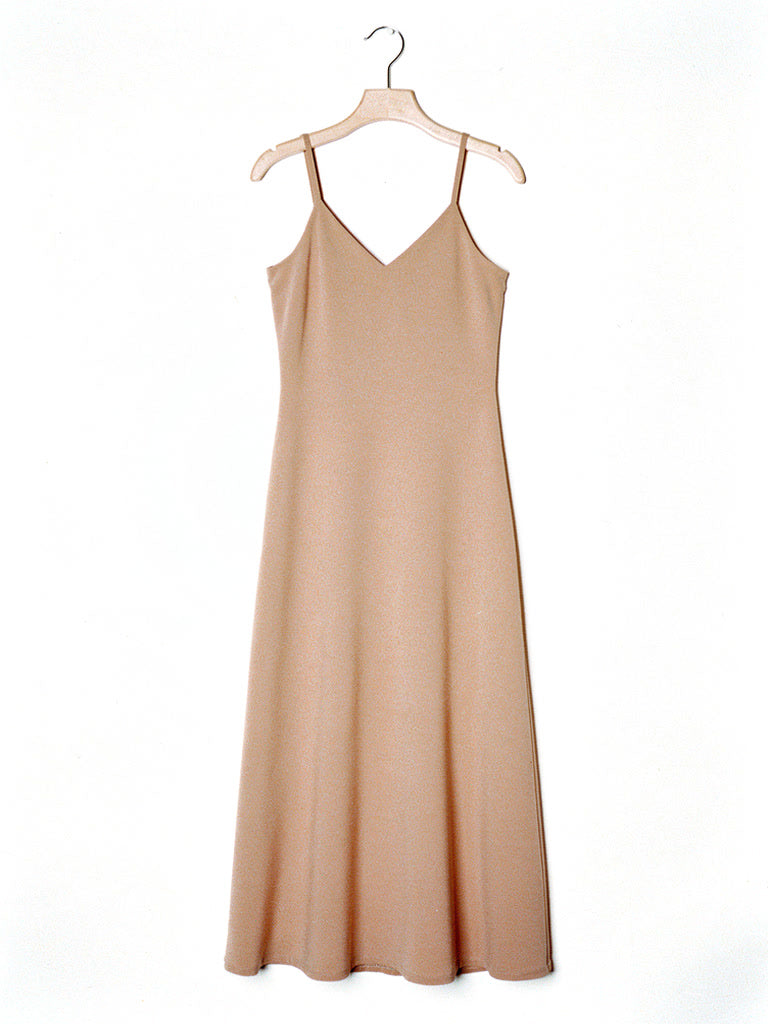 Almond slip dress on a wooden hanger, strappy V neck A line maxi, front view