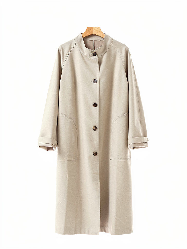 Stand collar coat in Sesame on a hanger, showing the band collar, the five button front and the patch pockets