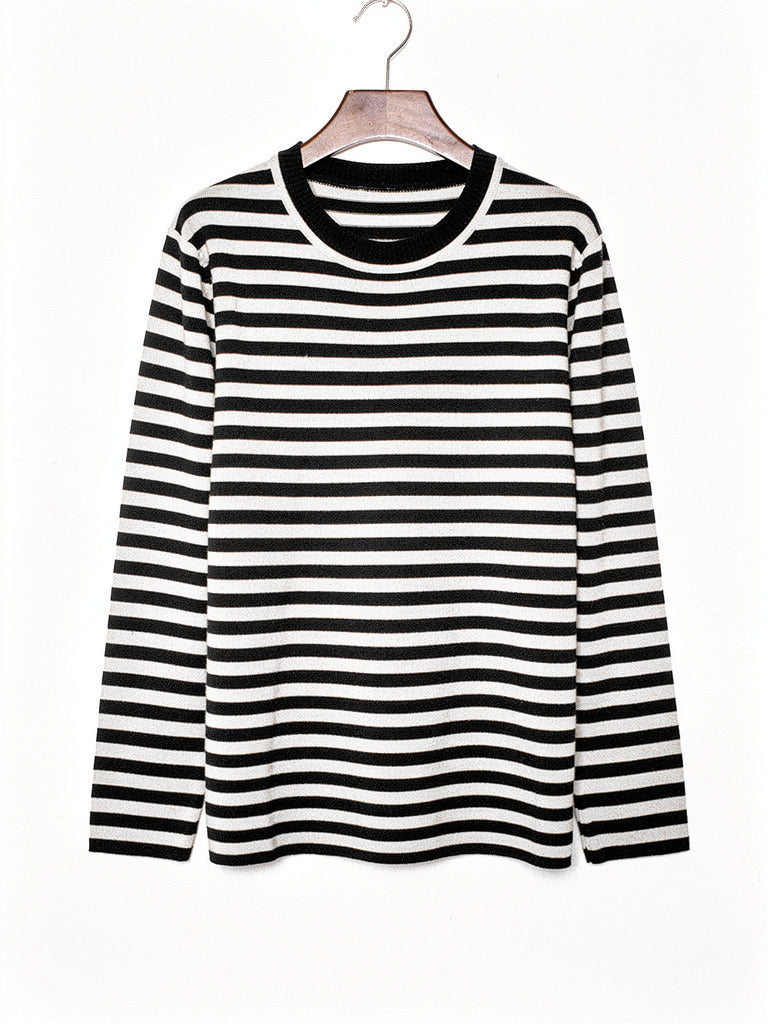 Black striped jumper in fine breton knit shown on a hanger
