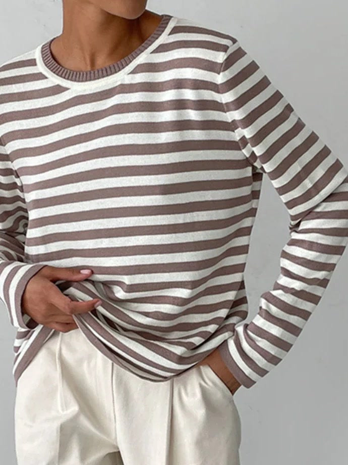 Fossil greige striped jumper worn with ecru trousers