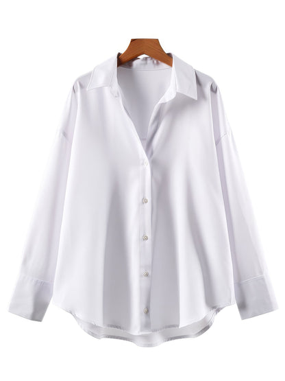 Oversized shirt in bright white on a hanger, front view
