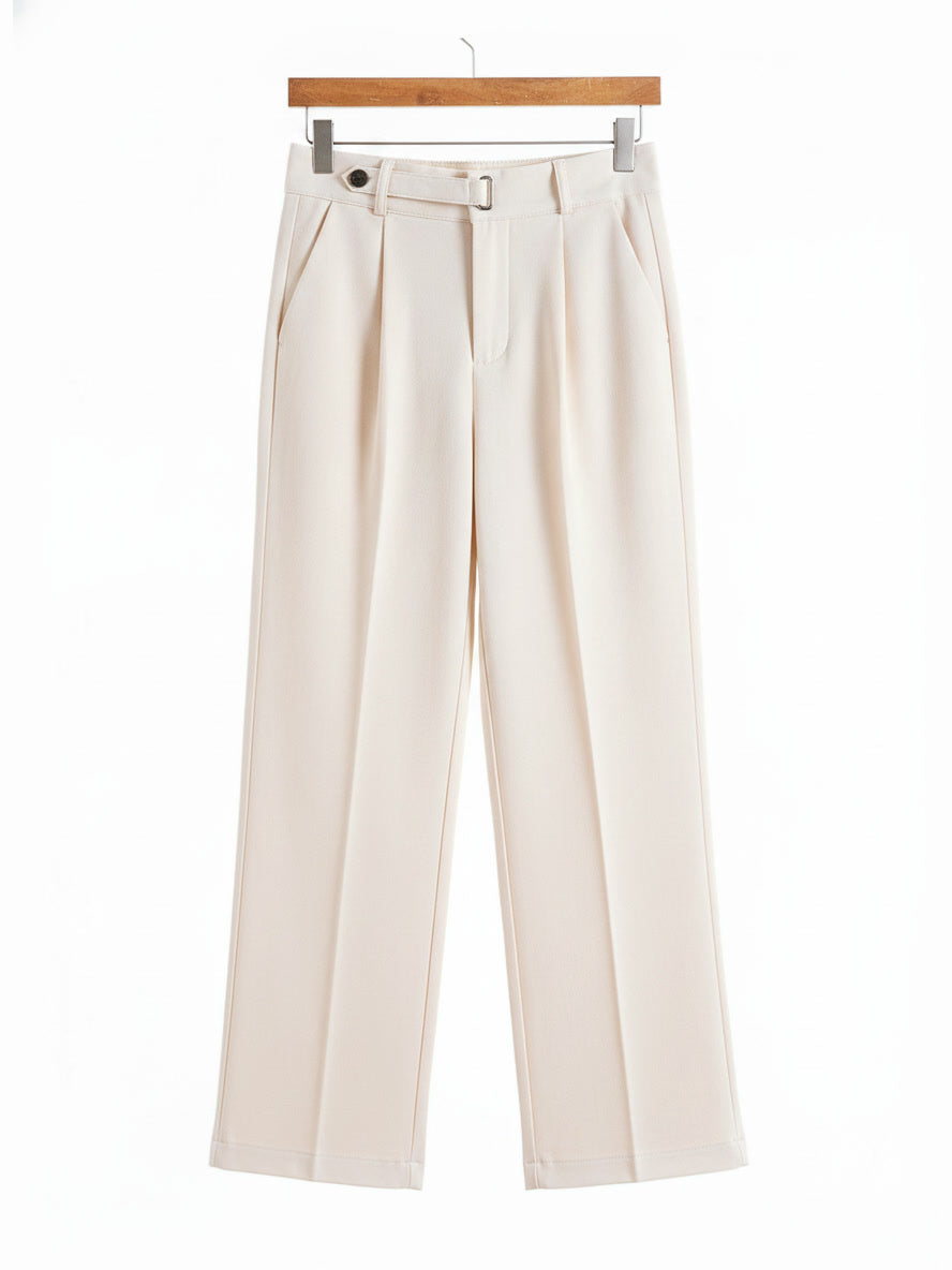 Tailored trousers in Clotted Cream brushed twill shown in full on a wooden hanger
