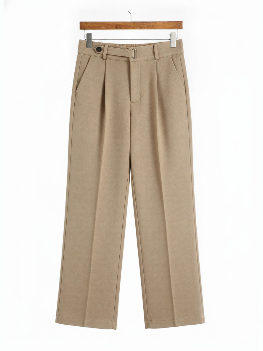 Tailored trousers in Nougat brushed twill shown in full on a wooden hanger