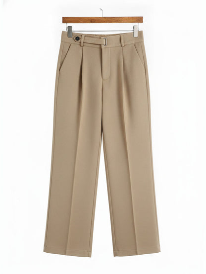 Tailored trousers in Nougat brushed twill shown in full on a wooden hanger