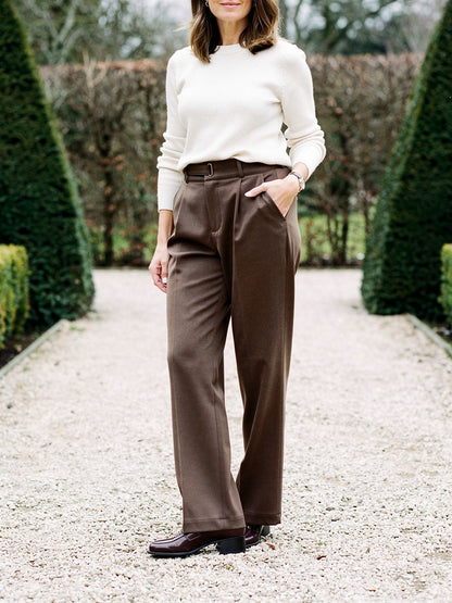 Womens tailored trousers in Muscovado brushed twill, straight leg worn with a cream knit on a garden path