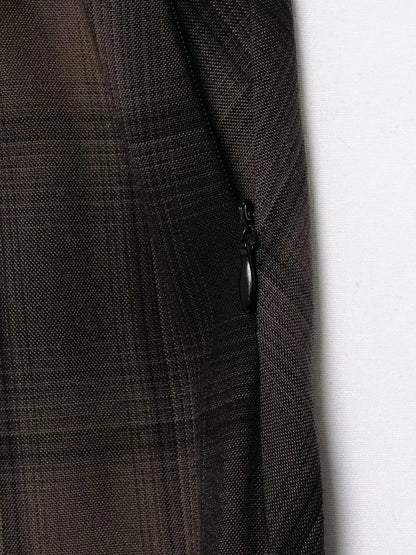 Close up of the shadow check cloth and the side seam zip on the tartan midi skirt