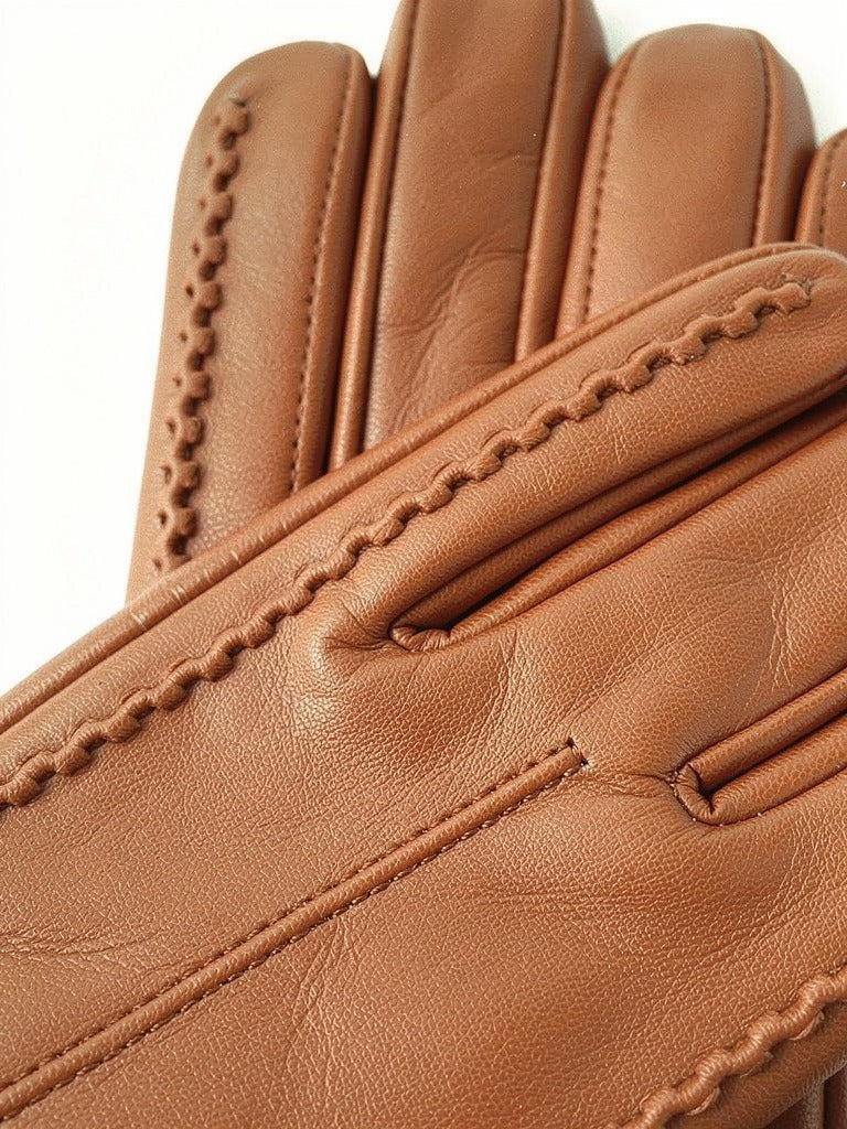 Close-up of the fine grain and fourchette stitching on the touch screen gloves