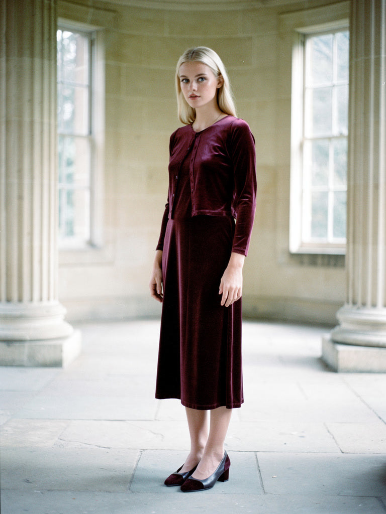 Velvet co-ord in Barolo, cropped velvet cardigan worn over a strappy midi dress, front view