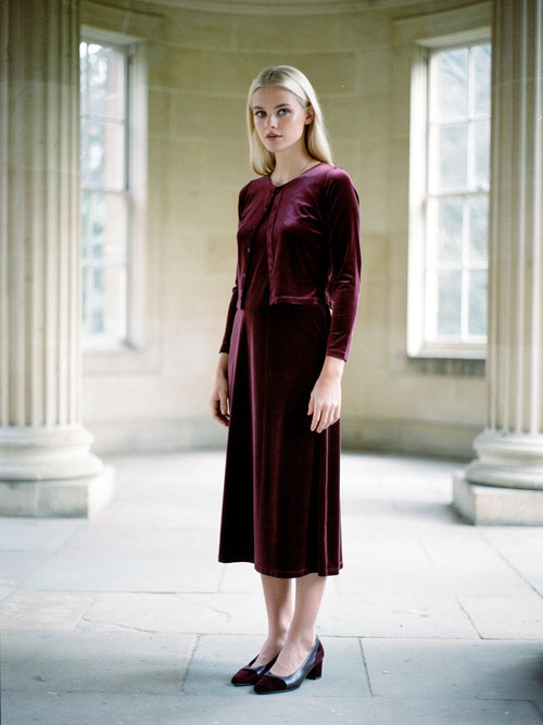 Velvet co-ord in Barolo, cropped velvet cardigan worn over a strappy midi dress, front view