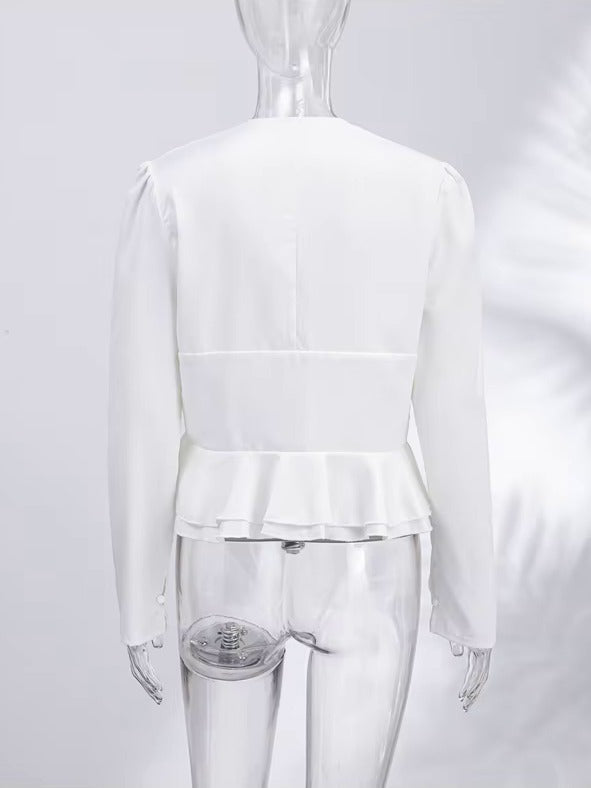 Back of the white peplum blouse showing the plain back and the double frill hem