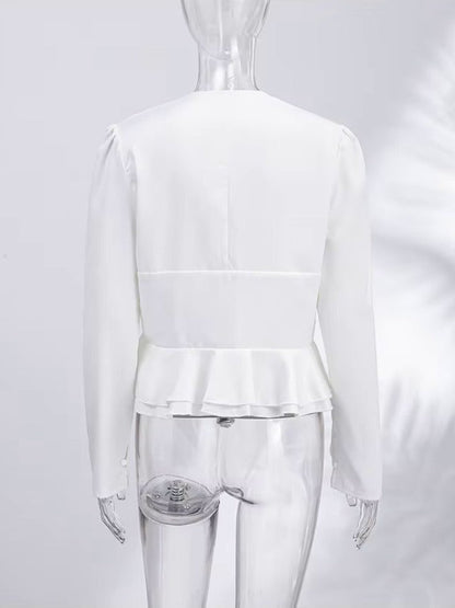 Back of the white peplum blouse showing the plain back and the double frill hem