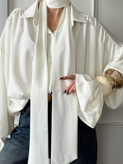 Large pointed collar and matching satin tie scarf on a white blouse