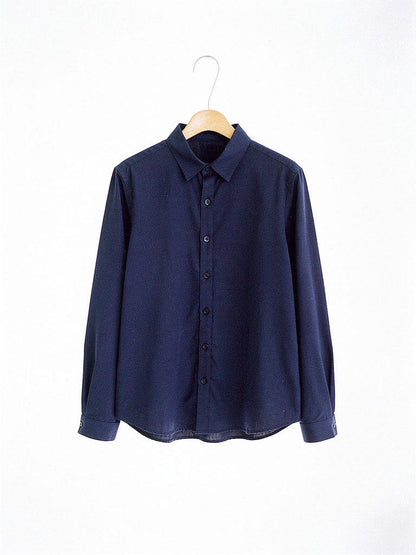 The same cotton shirt in Admiralty Navy on a hanger, front view