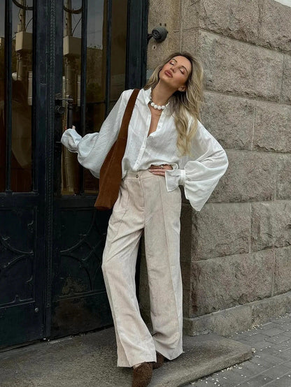 Womens white tunic shirt styled with camel suede accessories