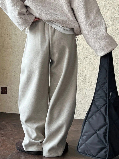Back view of the putty wide-leg trousers, plain seat with no back pockets