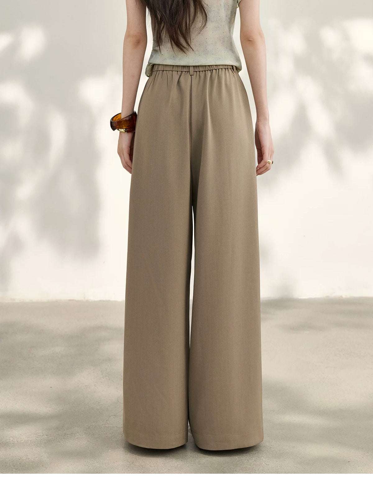 Winsley wide-leg trousers in taupe, back view showing the elasticated waist