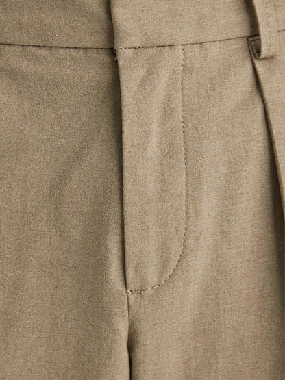 Close-up of the matte tailored weave and pressed pleat of the Winsley trousers in taupe