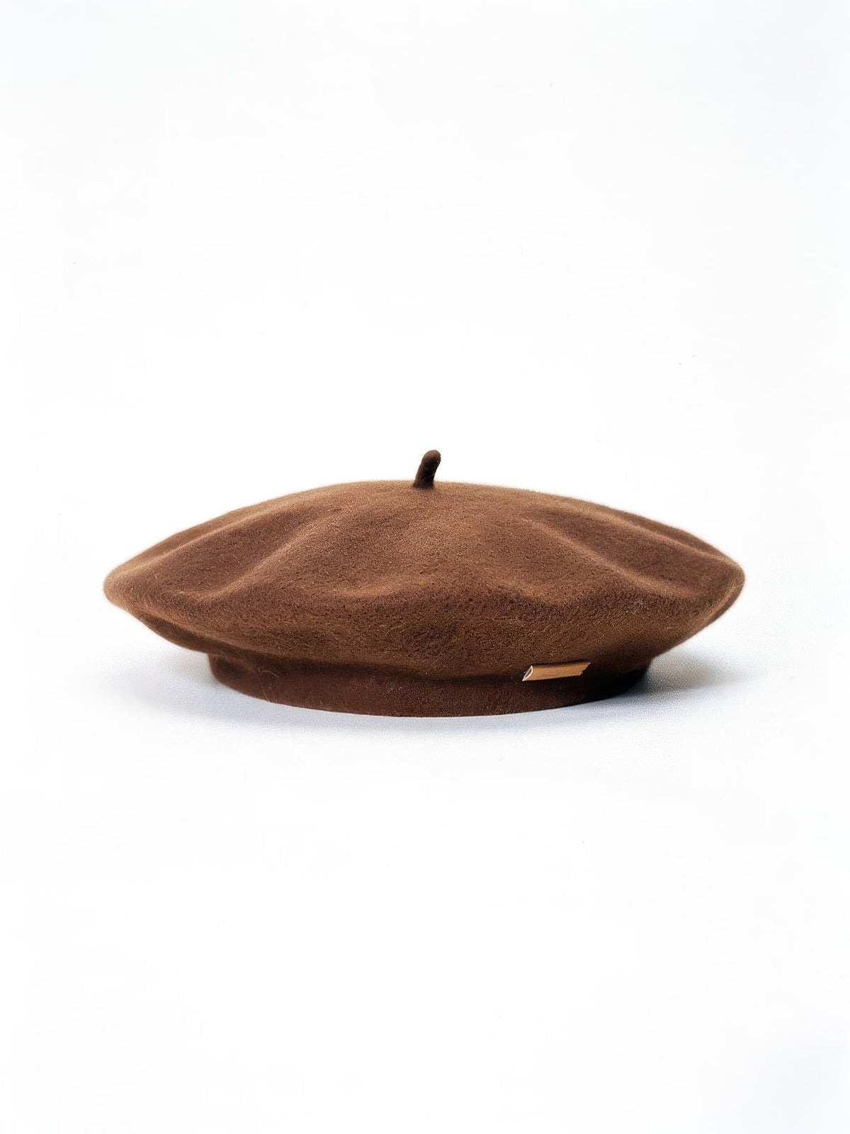 Womens beret hat in Fudge warm brown felt, side view with topknot