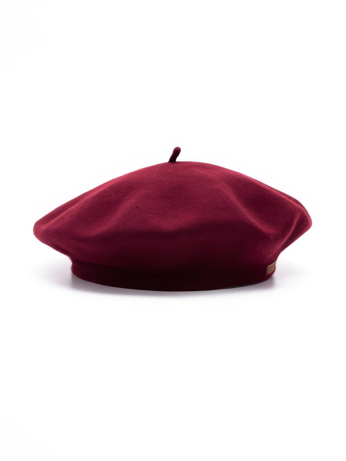 Womens beret hat in Rosehip wine red felt, side view with topknot