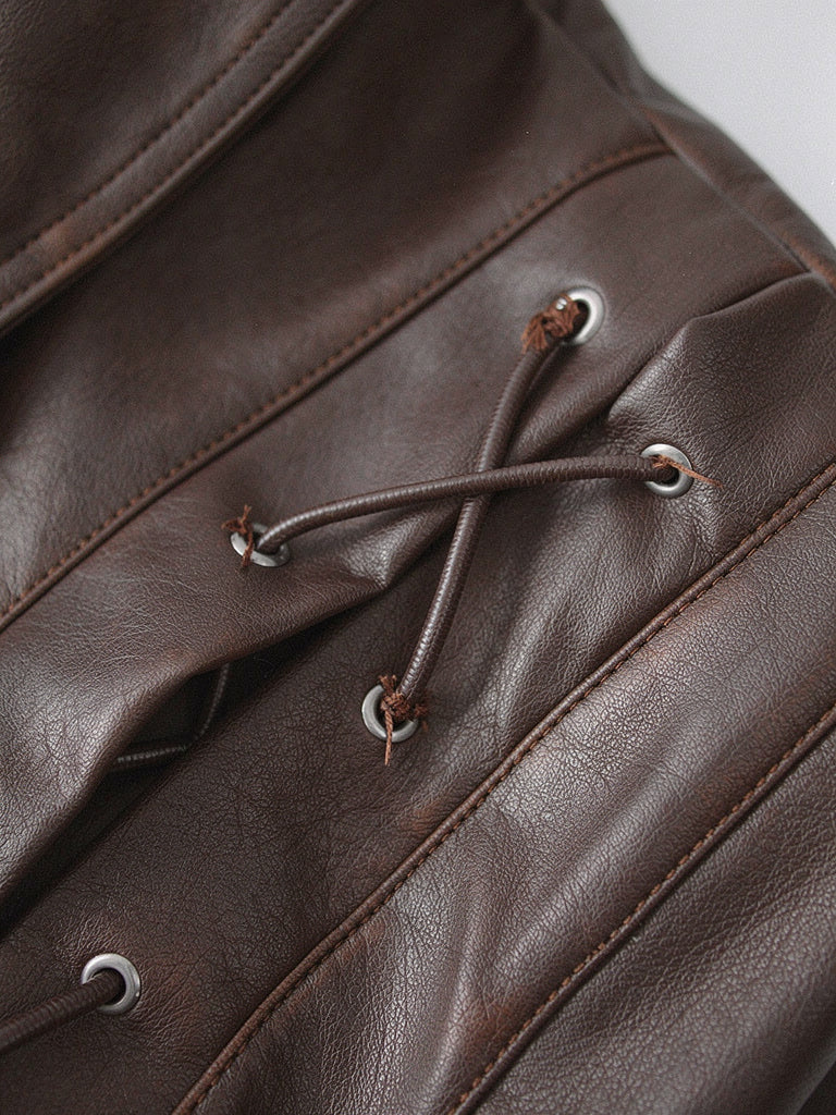 Close-up of the laced eyelet shoulder detail on the Hazleton brown faux leather jacket