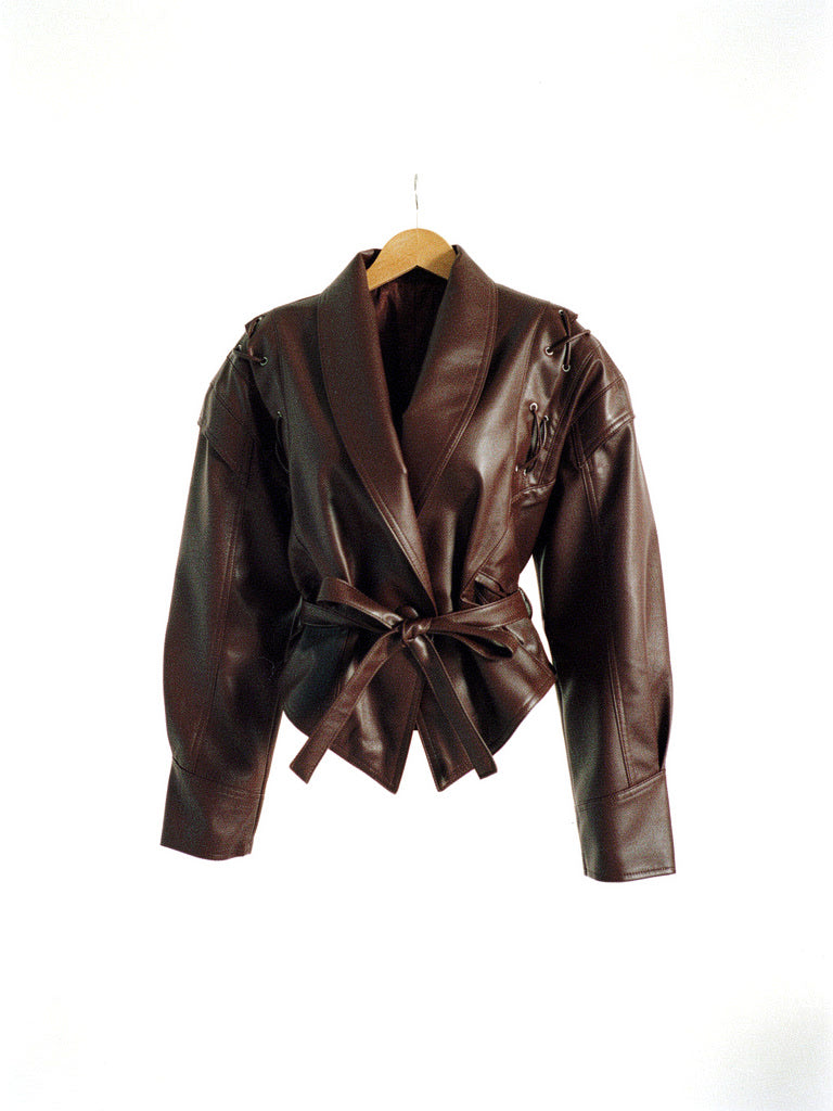 Hazleton brown faux leather jacket on a hanger, front view, showing the shawl collar and tie belt