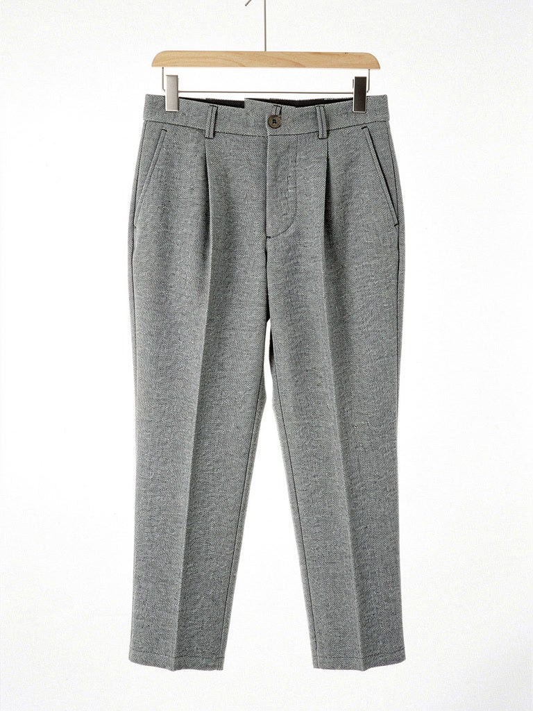 Pewter herringbone twill high-waisted tapered trousers on a hanger, front view