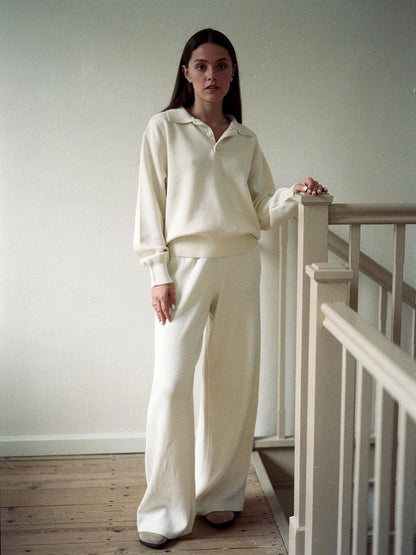 Womens knitted co-ord set in Chantilly, polo neck jumper and wide leg trousers worn indoors