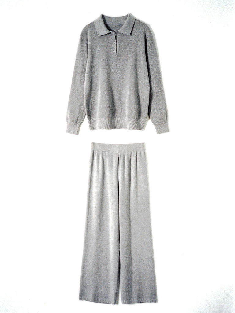 Womens knitted co-ord set in Sterling, polo neck jumper and wide leg trousers laid flat