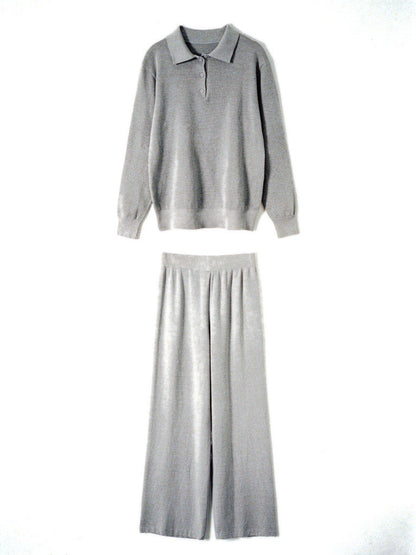 Womens knitted co-ord set in Sterling, polo neck jumper and wide leg trousers laid flat