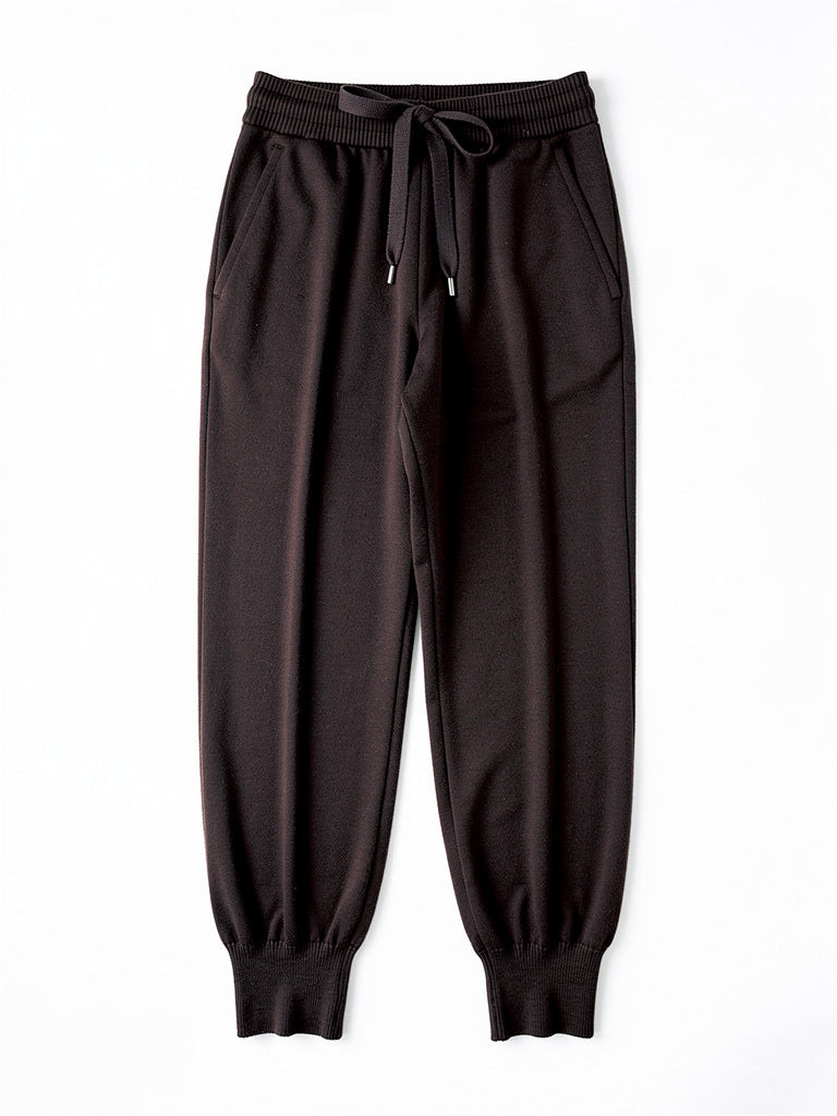 Womens knitted merino wool trousers in Dark Cocoa, laid flat