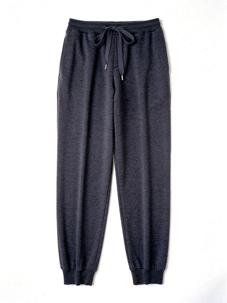 Womens knitted merino wool trousers in Graphite, laid flat