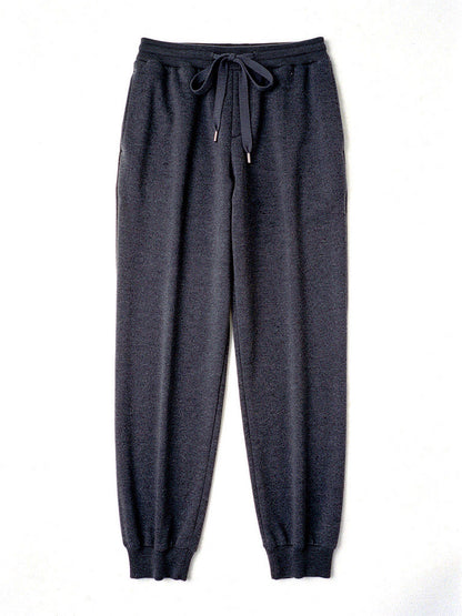 Womens knitted merino wool trousers in Graphite, laid flat