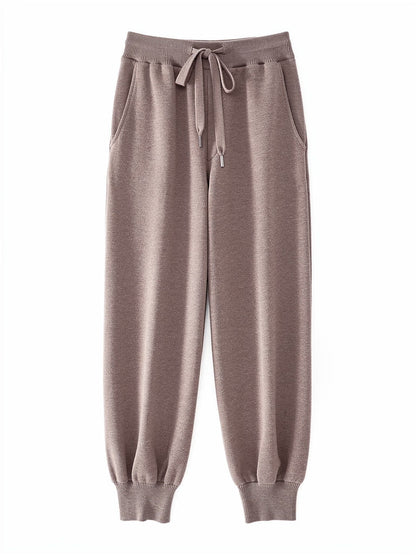 Womens knitted merino wool trousers in Mushroom, laid flat