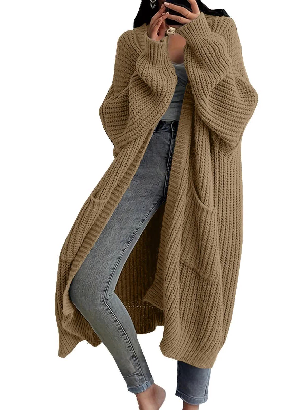 Camel longline chunky rib cardigan worn open over jeans