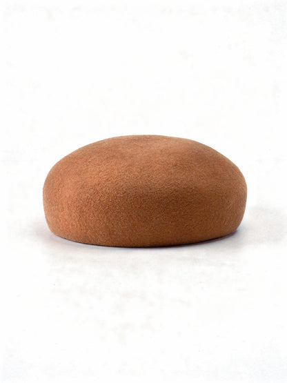 Gingerbread wool beret with a seamless felt domed crown, side view