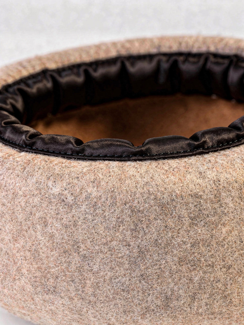 Padded satin band stitched inside the wool beret, with the fine felt nap
