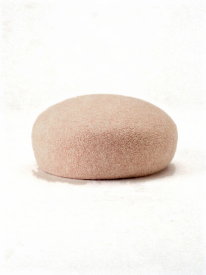 Shell wool beret with a seamless felt domed crown, side view